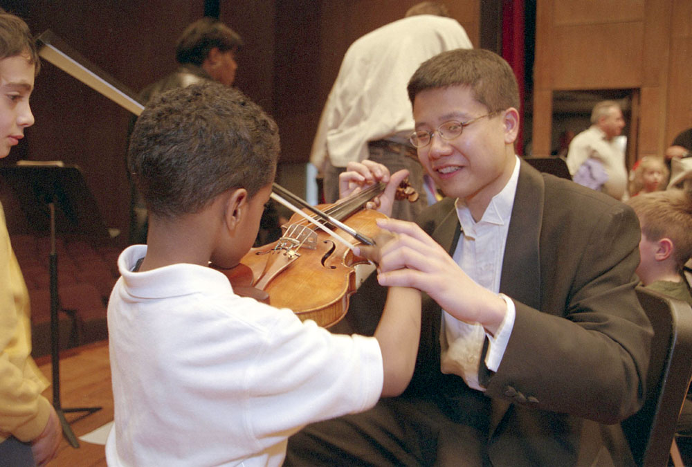 Child tries violin