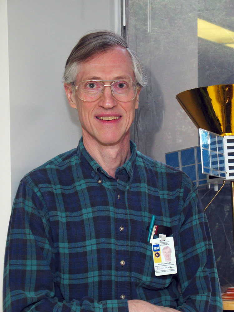 John Mather next to COBE model